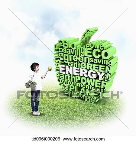 a boy standing with apple in front of an apple icon with green words View Large Photo Image Stock Photograph - a boy standing with apple in front of an apple icon with green words . Fotosearch