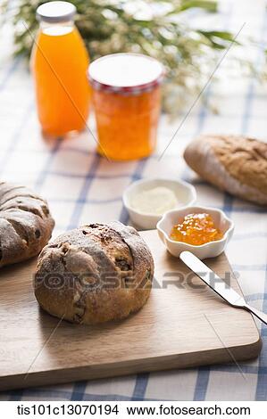 a bread next to a jam plate View Large Photo Image Picture - a bread next to a jam plate. Fotosearch