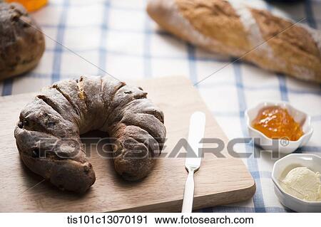 a bread next to a jam plate View Large Photo Image Stock Image - a bread next to a jam plate. Fotosearch