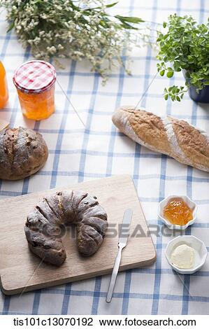 a bread next to a jam plate View Large Photo Image Stock Image - a bread next to a jam plate. Fotosearch