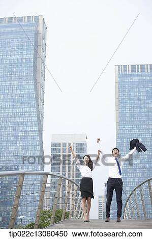 a business man and a business woman being excited View Large Photo Image Stock Image - a business man and a business woman being excited. Fotosearch