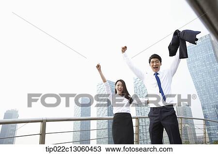 a business man and a business woman being excited View Large Photo Image Stock Image - a business man and a business woman being excited. Fotosearch