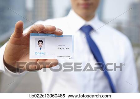 a business man showing access card View Large Photo Image Stock Photography - a business man showing access card. Fotosearch