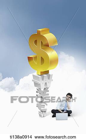 a business man sitting next to illustrated currency signs View Large Photo Image Picture - a business man sitting next to illustrated currency signs. Fotosearch