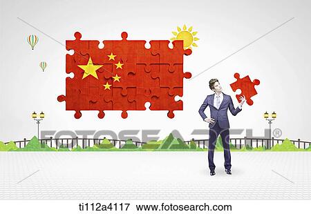 Stock Photo - a business man standing next to Chinese flag puzzle. Fotosearch