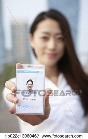 a business woman showing access card View Large Photo Image Stock Photo - a business woman showing access card. Fotosearch