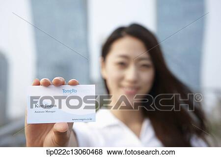 a business woman showing business card View Large Photo Image Stock Photo - a business woman showing business card. Fotosearch