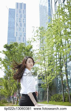 a business woman walking on the street View Large Photo Image Stock Image - a business woman walking on the street. Fotosearch