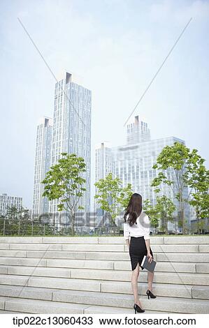 a business woman walking up stairs View Large Photo Image Stock Image - a business woman walking up stairs. Fotosearch