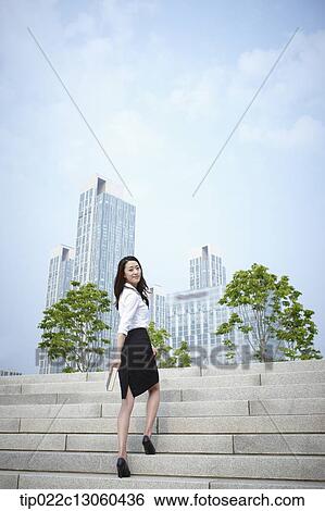 a business woman walking up stairs View Large Photo Image Stock Photograph - a business woman walking up stairs. Fotosearch