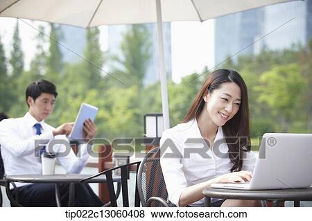 a business woman working View Large Photo Image Stock Photo - a business woman working. Fotosearch