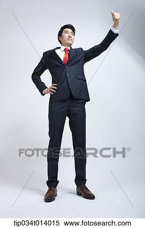 a businessman in red neck time showing thumb up View Large Photo Image Stock Photography - a businessman in red neck time showing thumb up. Fotosearch