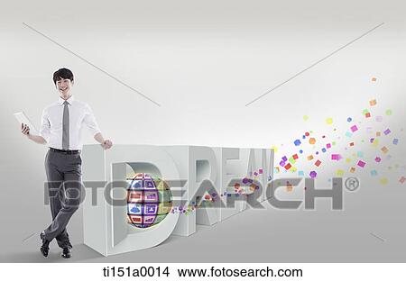 Picture - a businessman leaning on a word dream. Fotosearch