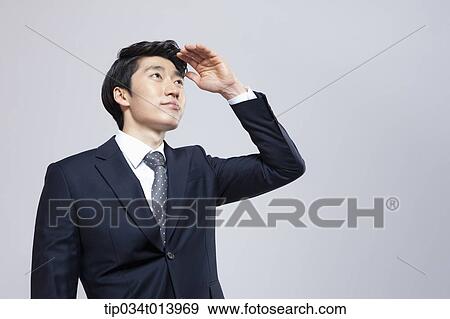 a businessman searching for something View Large Photo Image Stock Photo - a businessman searching for something. Fotosearch