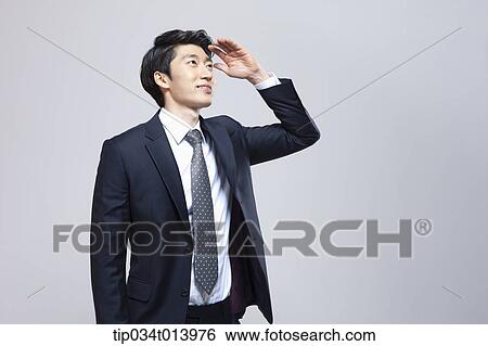 a businessman searching for something View Large Photo Image Stock Photograph - a businessman searching for something. Fotosearch