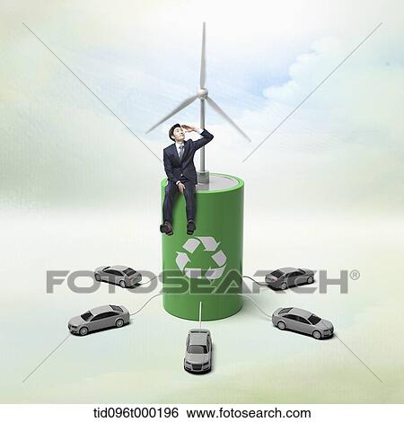 a businessman sitting on green energy charger View Large Photo Image Stock Photograph - a businessman sitting on green energy charger . Fotosearch