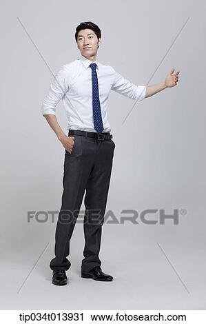 a businessman with hand gesture View Large Photo Image Stock Image - a businessman with hand gesture. Fotosearch