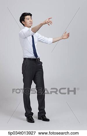 Stock Photo - a businessman with hand gesture. Fotosearch