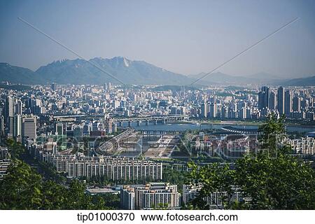 a city in front of mountains View Large Photo Image Stock Image - a city in front of mountains. Fotosearch