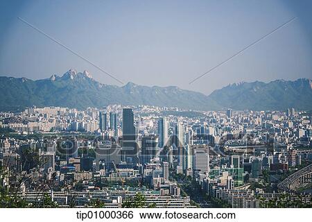 a city in front of mountains View Large Photo Image Stock Photograph - a city in front of mountains. Fotosearch