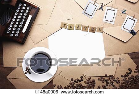 Stock Photograph - a coffee cup next to a type writer. Fotosearch