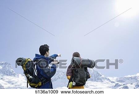 a couple hiking in the mountains View Large Photo Image Stock Photo - a couple hiking in the mountains. Fotosearch