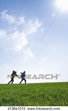 a couple hiking with a map View Large Photo Image Stock Photography - a couple hiking with a map . Fotosearch