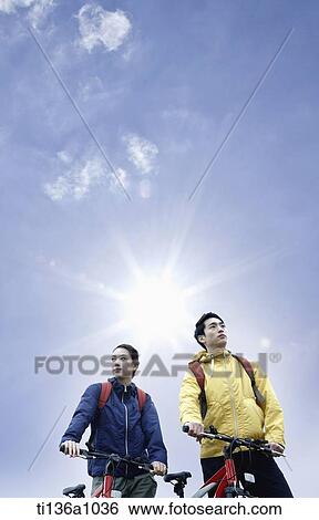 a couple hiking with bikes View Large Photo Image Stock Photograph - a couple hiking with bikes. Fotosearch