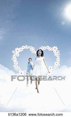 a couple running in the sky View Large Photo Image Stock Photograph - a couple running in the sky. Fotosearch