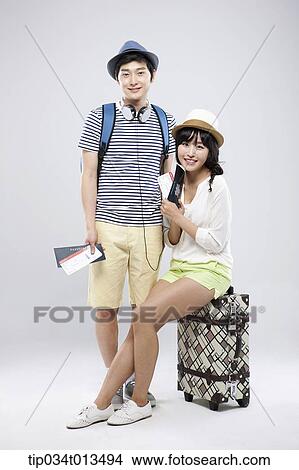 a couple with a suitcase View Large Photo Image Picture - a couple with a suitcase. Fotosearch