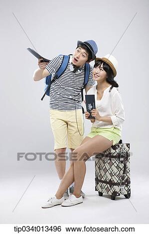 a couple with a suitcase View Large Photo Image Stock Photograph - a couple with a suitcase. Fotosearch