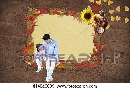 a father and a daughter sitting in a frame of leaves View Large Photo Image Stock Photo - a father and a daughter sitting in a frame of leaves. Fotosearch