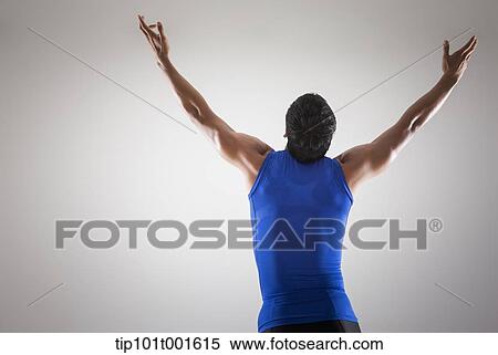 a fit man in blue shirt posing with hands View Large Photo Image Stock Photography - a fit man in blue shirt posing with hands. Fotosearch