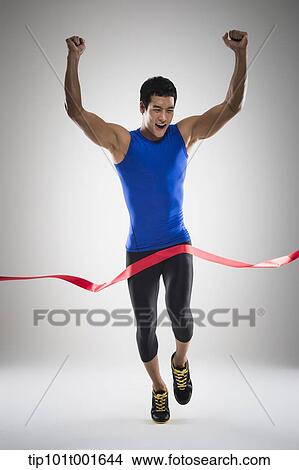 a fit man in blue shirt running to a finishing line View Large Photo Image Picture - a fit man in blue shirt running to a finishing line. Fotosearch