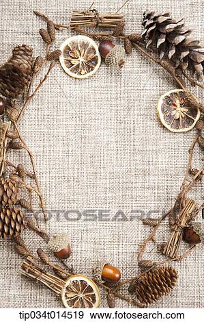 Stock Photo - a frame forming with autumn leaves and nuts . Fotosearch