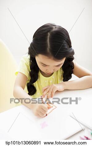 a girl drawing on a sketch book with crayon View Large Photo Image Stock Image - a girl drawing on a sketch book with crayon. Fotosearch