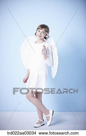 a girl dressed as an angel View Large Photo Image Picture - a girl dressed as an angel. Fotosearch