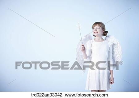 a girl dressed as an angel View Large Photo Image Stock Image - a girl dressed as an angel. Fotosearch