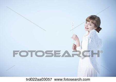 a girl dressed as an angel View Large Photo Image Stock Photo - a girl dressed as an angel. Fotosearch