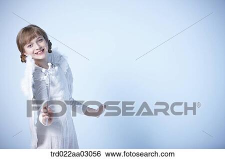a girl dressed as an angel View Large Photo Image Stock Photograph - a girl dressed as an angel. Fotosearch