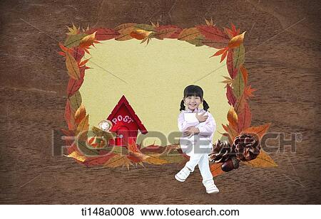 Stock Photo - a girl sitting in a frame of leaves. Fotosearch