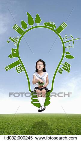 a girl sitting on green light bulb View Large Photo Image Stock Photography - a girl sitting on green light bulb . Fotosearch