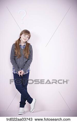 a girl standing under a question mark View Large Photo Image Stock Image - a girl standing under a question mark. Fotosearch