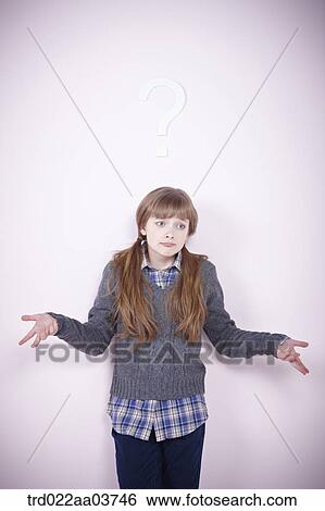 a girl standing under a question mark View Large Photo Image Stock Photograph - a girl standing under a question mark. Fotosearch