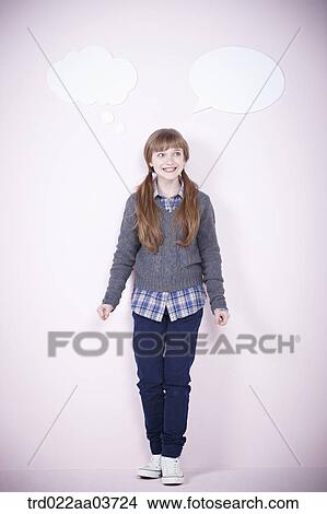 a girl standing with a speech bubbles next to her View Large Photo Image Picture - a girl standing with a speech bubbles next to her. Fotosearch
