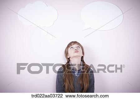 Stock Image - a girl standing with a speech bubbles next to her. Fotosearch