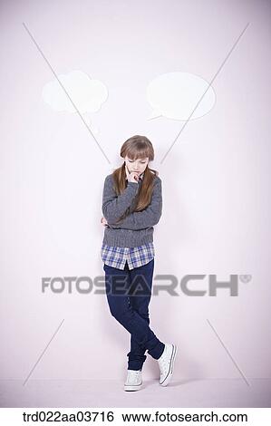 a girl standing with a speech bubbles next to her View Large Photo Image Stock Photograph - a girl standing with a speech bubbles next to her. Fotosearch