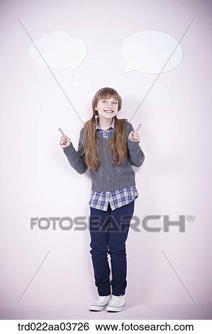 a girl standing with a speech bubbles next to her View Large Photo Image Stock Photograph - a girl standing with a speech bubbles next to her. Fotosearch