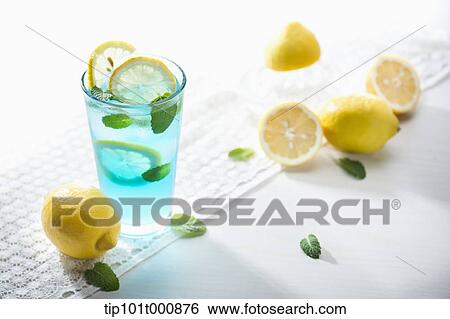 a glass of blue liquid with lemons View Large Photo Image Stock Photograph - a glass of blue liquid with lemons. Fotosearch
