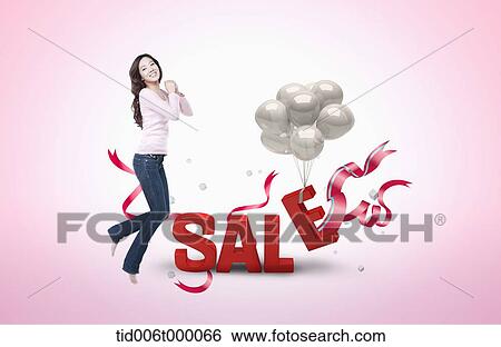 a happy woman next to a word sale View Large Photo Image Stock Photograph - a happy woman next to a word sale. Fotosearch
